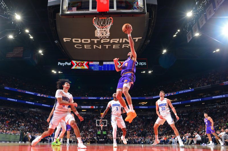 PHOENIX, AZ - NOVEMBER 18: Devin Booker #1 of the Phoenix Suns drives to the basket during the game against the Orlando Magic on November 18, 2024 at Footprint Center in Phoenix, Arizona. NOTE TO USER: User expressly acknowledges and agrees that, by downloading and or using this photograph, user is consenting to the terms and conditions of the Getty Images License Agreement. Mandatory Copyright Notice: Copyright 2024 NBAE (Photo by Kate Frese/NBAE via Getty Images)