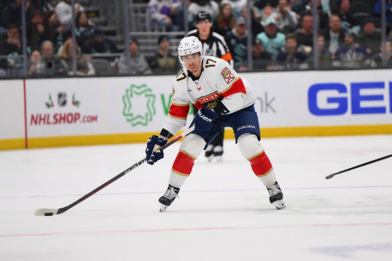 Dec 12, 2023; Seattle, Washington, USA; Florida Panthers center Evan Rodrigues (17) looks to pass the puck during the third against the Seattle Kraken period at Climate Pledge Arena. Mandatory Credit: Steven Bisig-USA TODAY Sports