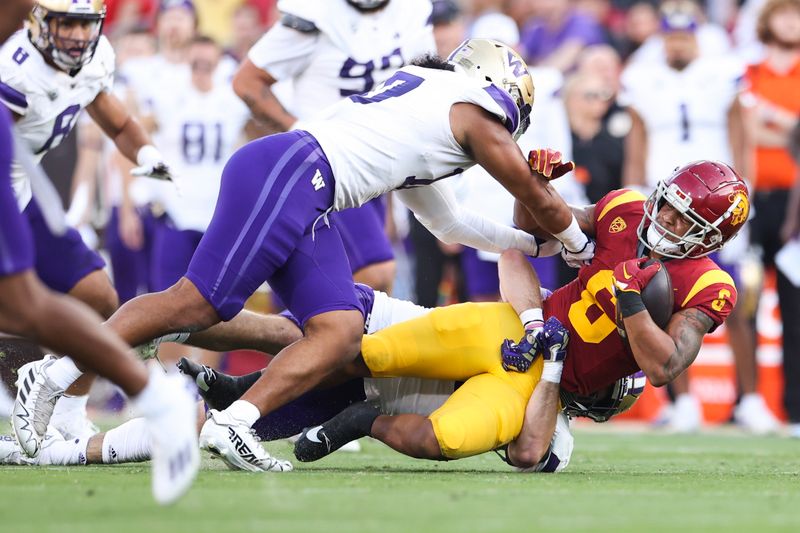 Nov 4, 2023; Los Angeles, California, USA; USC Trojans running back Austin Jones (6) is tackled during the first quarter against the Washington Huskies at United Airlines Field at Los Angeles Memorial Coliseum. Mandatory Credit: Jessica Alcheh-USA TODAY Sports