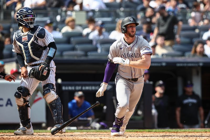 Aug 25, 2024; Bronx, New York, USA;  Colorado Rockies third baseman Ryan McMahon (24) hits an RBI double in the fifth inning against the New York Yankees at Yankee Stadium. Mandatory Credit: Wendell Cruz-USA TODAY Sports