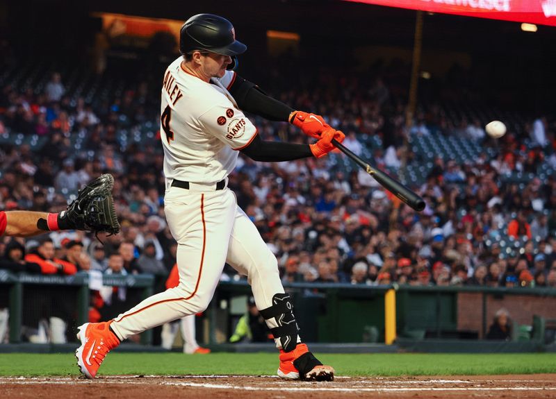 Aug 28, 2023; San Francisco, California, USA; San Francisco Giants catcher Patrick Bailey (14) hits an RBI double against the Cincinnati Reds during the third inning at Oracle Park. Mandatory Credit: Kelley L Cox-USA TODAY Sports