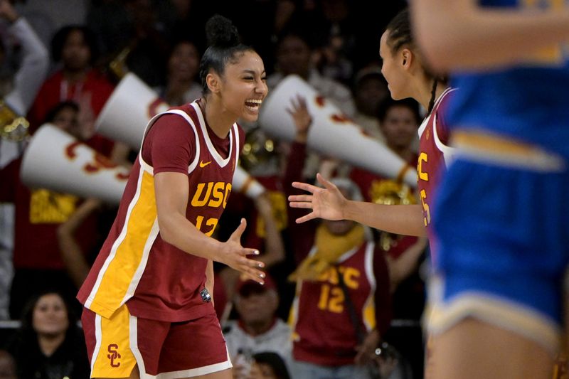 Jan 14, 2024; Los Angeles, California, USA; USC Trojans guard JuJu Watkins (12) celebrates in the fourth quarter after defeating the UCLA Bruins at Galen Center. Mandatory Credit: Jayne Kamin-Oncea-USA TODAY Sports