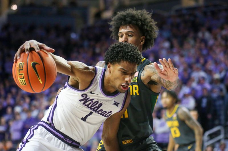 Jan 16, 2024; Manhattan, Kansas, USA; Kansas State Wildcats forward David N'Guessan (1) is guarded by Baylor Bears forward Jalen Bridges (11) during the first half at Bramlage Coliseum. Mandatory Credit: Scott Sewell-USA TODAY Sports