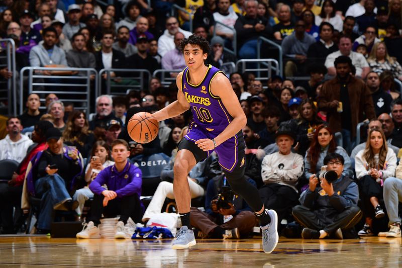 LOS ANGELES, CA - MARCH 22: Max Christie #10 of the Los Angeles Lakers dribbles the ball during the game against the Philadelphia 76ers on March 22, 2024 at Crypto.Com Arena in Los Angeles, California. NOTE TO USER: User expressly acknowledges and agrees that, by downloading and/or using this Photograph, user is consenting to the terms and conditions of the Getty Images License Agreement. Mandatory Copyright Notice: Copyright 2024 NBAE (Photo by Adam Pantozzi/NBAE via Getty Images)