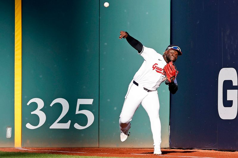 Oct 7, 2024; Cleveland, Ohio, USA; Cleveland Guardians outfielder Jhonkensy Noel (43) throws to second base for an out during the fifth inning during game two of the ALDS for the 2024 MLB Playoffs at Progressive Field. Mandatory Credit: Scott Galvin-Imagn Images