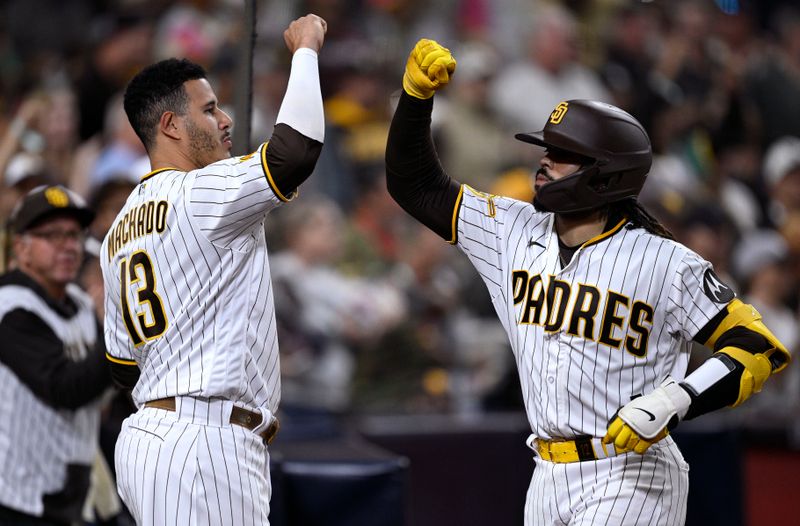 Sep 18, 2023; San Diego, California, USA; San Diego Padres catcher Luis Campusano (right) is congratulated by designated hitter Manny Machado (13) after hitting a three-run home run against the Colorado Rockies during the third inning at Petco Park. Mandatory Credit: Orlando Ramirez-USA TODAY Sports