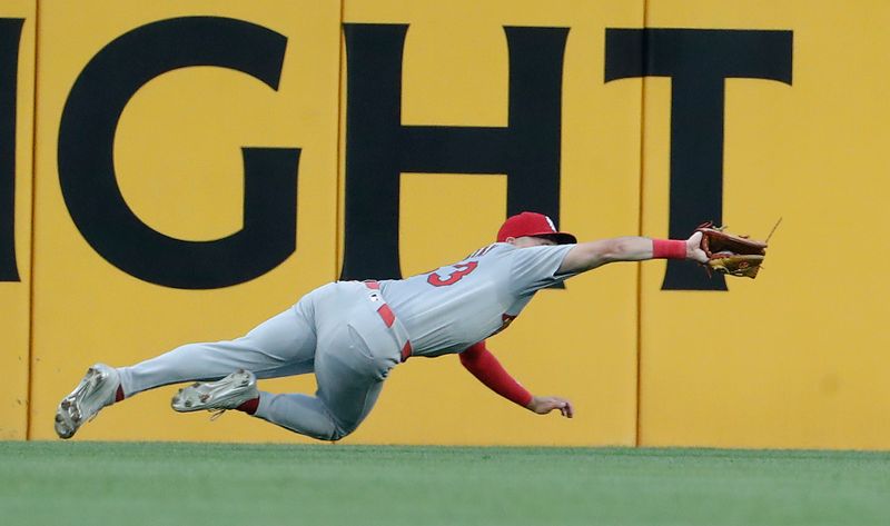 Jul 3, 2024; Pittsburgh, Pennsylvania, USA;  St. Louis Cardinals center fielder Michael Siani (63) makes a diving catch for an out on a ball hit by Pittsburgh Pirates shortstop Oneil Cruz (not pictured) during the sixth inning at PNC Park. Mandatory Credit: Charles LeClaire-USA TODAY Sports