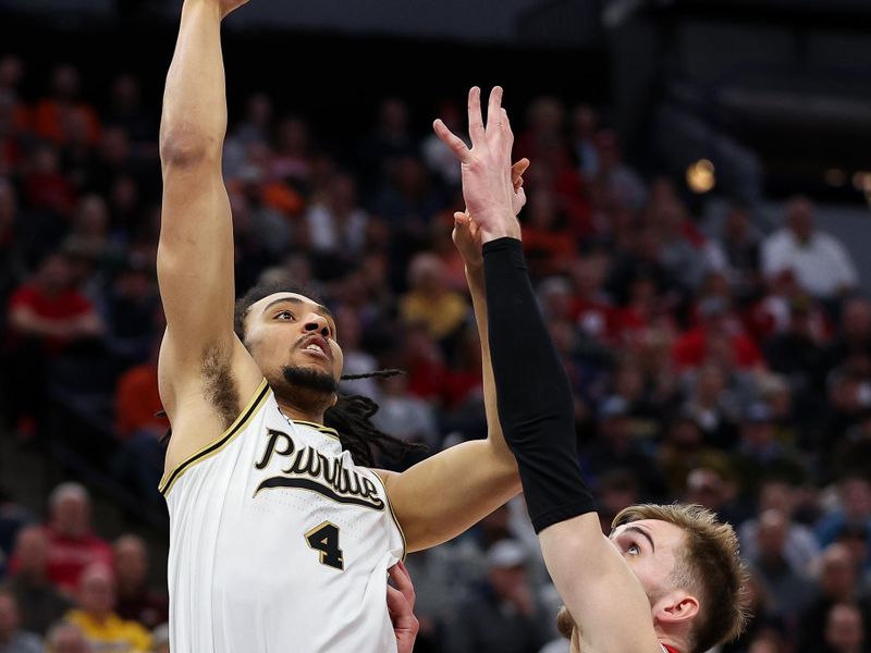 Mar 16, 2024; Minneapolis, MN, USA; Purdue Boilermakers forward Trey Kaufman-Renn (4) shoots as Wisconsin Badgers forward Tyler Wahl (5) defends during the first half at Target Center. Mandatory Credit: Matt Krohn-USA TODAY Sports