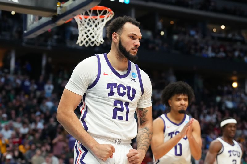 Mar 17, 2023; Denver, CO, USA; TCU Horned Frogs forward JaKobe Coles (21) reacts after a play during the second half against the Arizona State Sun Devils at Ball Arena. Mandatory Credit: Ron Chenoy-USA TODAY Sports