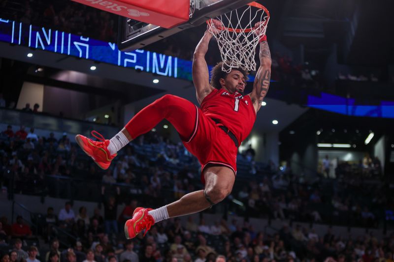 Feb 1, 2025; Atlanta, Georgia, USA; Georgia Tech Yellow Jackets guard Naithan George (1) dunks against the Louisville Cardinals in the first half at McCamish Pavilion. Mandatory Credit: Brett Davis-Imagn Images