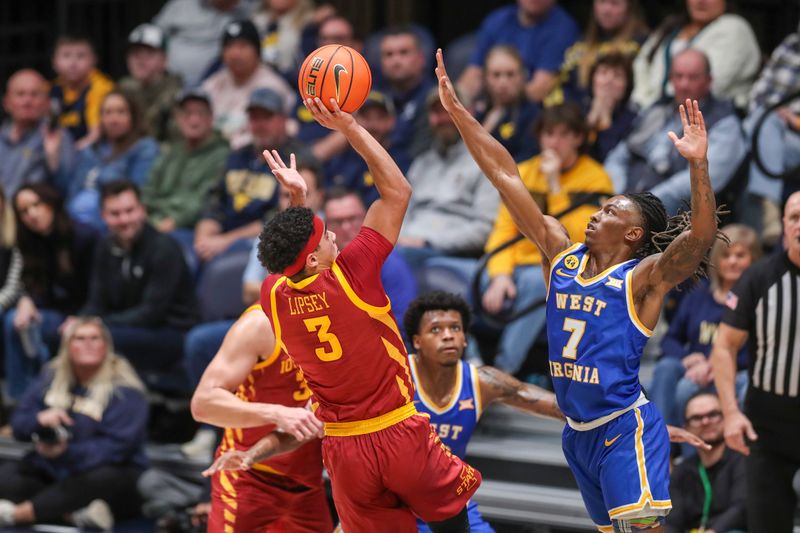 Jan 18, 2025; Morgantown, West Virginia, USA; Iowa State Cyclones guard Tamin Lipsey (3) shoots over West Virginia Mountaineers guard Javon Small (7) during the first half at WVU Coliseum. Mandatory Credit: Ben Queen-Imagn Images