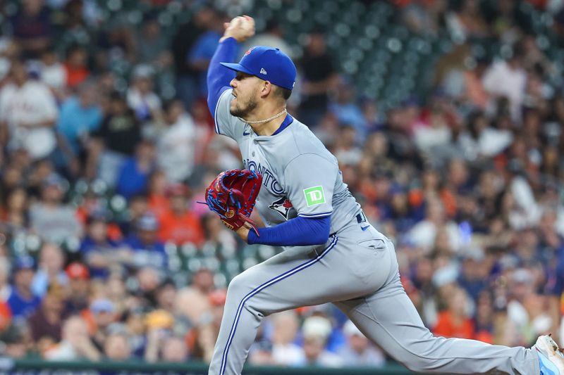 Apr 2, 2024; Houston, Texas, USA; Toronto Blue Jays starting pitcher Jose Berrios (17) delivers a pitch during the first inning against the Houston Astros at Minute Maid Park. Mandatory Credit: Troy Taormina-USA TODAY Sports