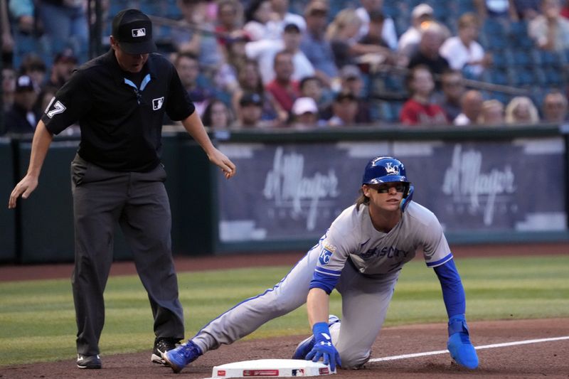 Apr 25, 2023; Phoenix, Arizona, USA; Kansas City Royals shortstop Bobby Witt Jr. (7) reacts after sliding safely into third base against the Arizona Diamondbacks during the first inning at Chase Field. Mandatory Credit: Joe Camporeale-USA TODAY Sports