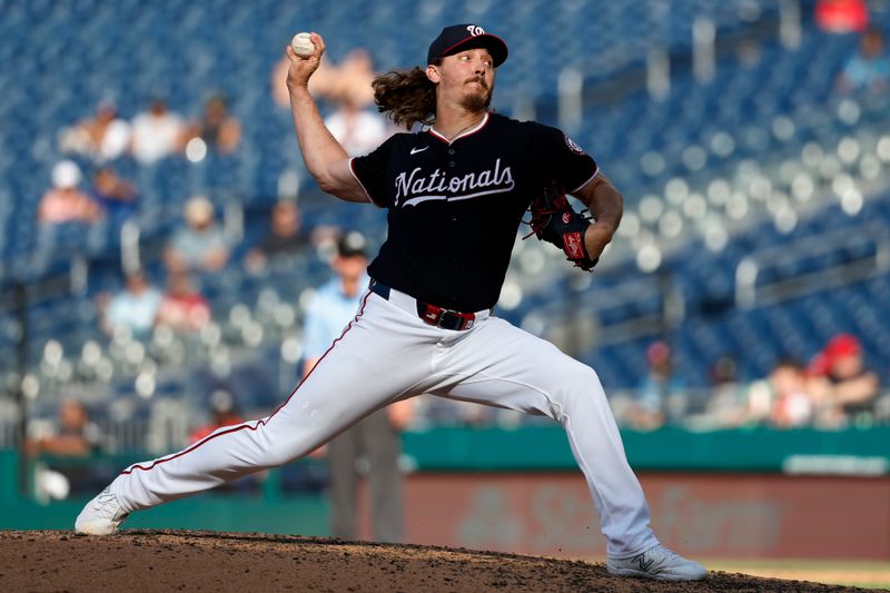 Jun 19, 2024; Washington, District of Columbia, USA; Washington Nationals pitcher Hunter Harvey (73) pitches against the Arizona Diamondbacks during the eighth inning at Nationals Park. Mandatory Credit: Geoff Burke-USA TODAY Sports