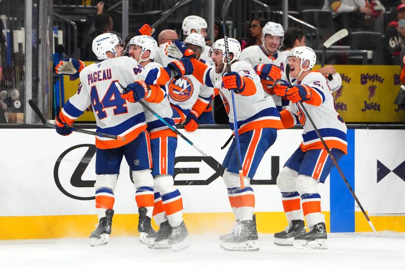 Nov 13, 2025; Las Vegas, Nevada, USA; New York Islanders center Jean-Gabriel Pageau (44) celebrates with team mates after scoring a short-handed goal against the Vegas Golden Knights during an overtime period to give the Islanders a 4-3 victory at T-Mobile Arena. Mandatory Credit: Stephen R. Sylvanie-Imagn Images