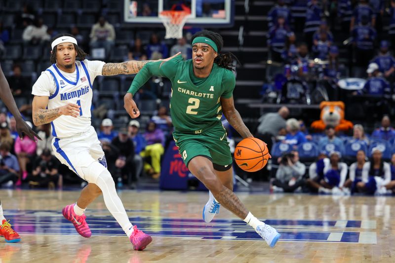 Feb 8, 2026; Memphis, Tennessee, USA; Charlotte 49ers guard Dezayne Mingo (2) drives against Memphis Tigers guard Dug McDaniel (1) during the second half at FedExForum. Mandatory Credit: Wesley Hale-Imagn Images