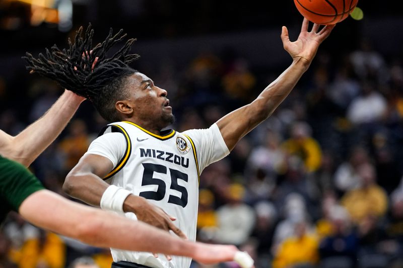 Nov 25, 2023; Columbia, Missouri, USA; Missouri Tigers guard Sean East II (55) shoots against Loyola (Md) Greyhounds forward Alonso Faure (4) during the second half at Mizzou Arena. Mandatory Credit: Jay Biggerstaff-USA TODAY Sports