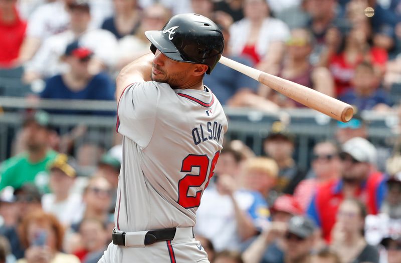 May 26, 2024; Pittsburgh, Pennsylvania, USA;  Atlanta Braves first baseman Matt Olson (28) hits a single against the Pittsburgh Pirates during the ninth inning at PNC Park. Atlanta won 8-1. Mandatory Credit: Charles LeClaire-USA TODAY Sports