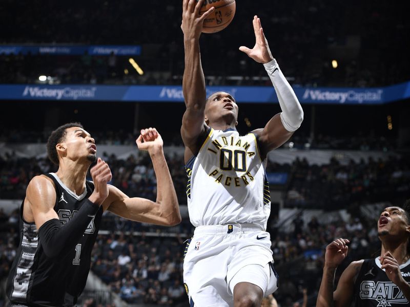 HOUSTON, TX - MARCH 3: Bennedict Mathurin #00 of the Indiana Pacers drives to the basket during the game against the San Antonio Spurs on March 3, 2024 at the Toyota Center in Houston, Texas. NOTE TO USER: User expressly acknowledges and agrees that, by downloading and or using this photograph, User is consenting to the terms and conditions of the Getty Images License Agreement. Mandatory Copyright Notice: Copyright 2024 NBAE (Photo by Logan Riely/NBAE via Getty Images)