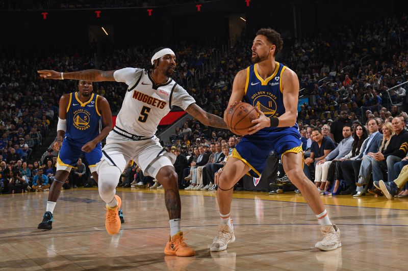 SAN FRANCISCO, CA - FEBRUARY 25:  Klay Thompson #11 of the Golden State Warriors handles the ball during the game against the Denver Nuggets on February 25, 2024 at Chase Center in San Francisco, California. NOTE TO USER: User expressly acknowledges and agrees that, by downloading and or using this photograph, user is consenting to the terms and conditions of Getty Images License Agreement. Mandatory Copyright Notice: Copyright 2024 NBAE (Photo by Noah Graham/NBAE via Getty Images)