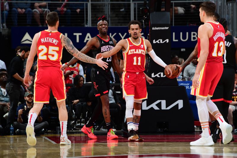 ATLANTA, GA - FEBRUARY 10: Trae Young #11 high fives Garrison Mathews #25 of the Atlanta Hawks during the game against the Houston Rockets on February 10, 2024 at State Farm Arena in Atlanta, Georgia.  NOTE TO USER: User expressly acknowledges and agrees that, by downloading and/or using this Photograph, user is consenting to the terms and conditions of the Getty Images License Agreement. Mandatory Copyright Notice: Copyright 2024 NBAE (Photo by Scott Cunningham/NBAE via Getty Images)