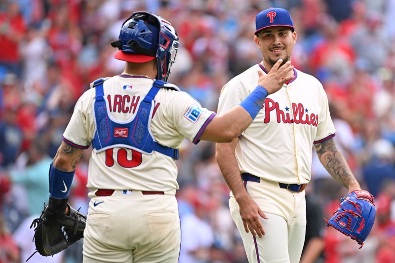 Aug 24, 2025; Philadelphia, Pennsylvania, USA; Philadelphia Phillies catcher Rafael Marchán (13) and Philadelphia Phillies pitcher Orion Kerkering (50) celebrate win against the Washington Nationals at Citizens Bank Park. Mandatory Credit: Eric Hartline-Imagn Images