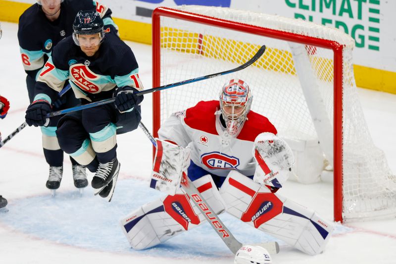 Mar 24, 2024; Seattle, Washington, USA; Seattle Kraken center Jaden Schwartz (17) jumps out of the way of a potential shot attempt against Montreal Canadiens goaltender Cayden Primeau (30) during the third period at Climate Pledge Arena. Mandatory Credit: Joe Nicholson-USA TODAY Sports