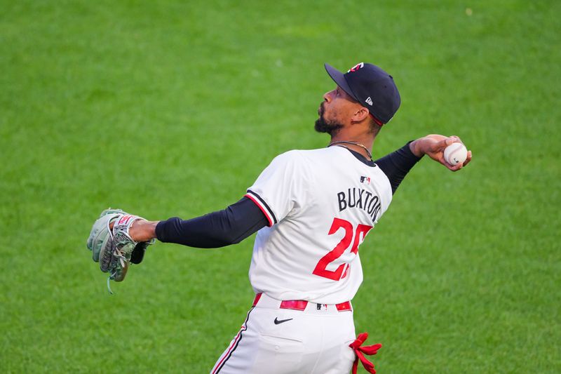 Jun 13, 2024; Minneapolis, Minnesota, USA; Minnesota Twins outfielder Byron Buxton (25) throws a ball to a fan after an out against the Oakland Athletics in the sixth inning at Target Field. Mandatory Credit: Brad Rempel-USA TODAY Sports