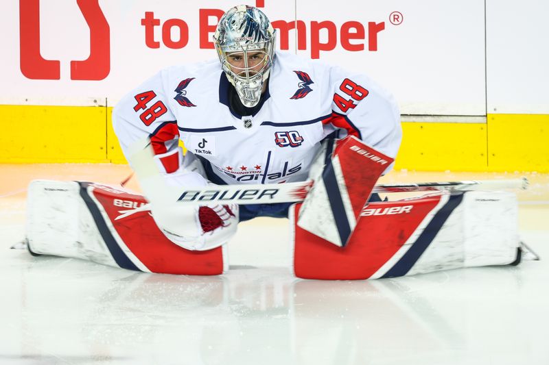 Jan 28, 2025; Calgary, Alberta, CAN; Washington Capitals goaltender Logan Thompson (48) during the warmup period against the Calgary Flames at Scotiabank Saddledome. Mandatory Credit: Sergei Belski-Imagn Images