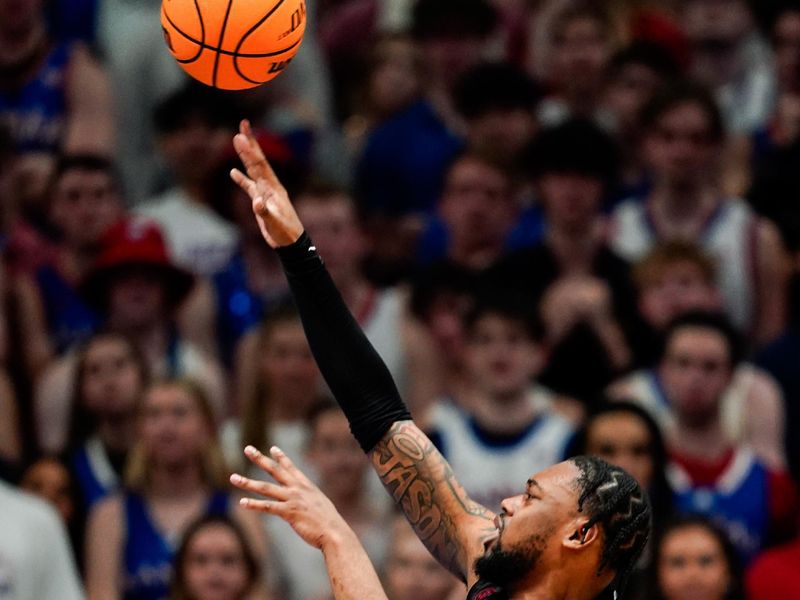 Feb 3, 2024; Lawrence, Kansas, USA; Kansas Jayhawks guard Elmarko Jackson (13) shoots during the second half against the Kansas Jayhawks at Allen Fieldhouse. Mandatory Credit: Jay Biggerstaff-USA TODAY Sports