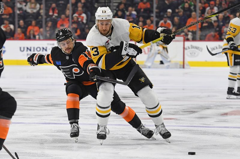 Feb 25, 2025; Philadelphia, Pennsylvania, USA; Pittsburgh Penguins right wing Kevin Hayes (13) is defended by Philadelphia Flyers right wing Travis Konecny (11) during the first period at Wells Fargo Center. Mandatory Credit: Eric Hartline-Imagn Images