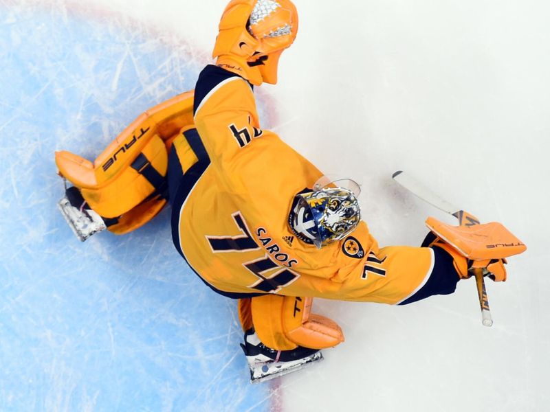 Jan 26, 2023; Nashville, Tennessee, USA; Nashville Predators goaltender Juuse Saros (74) allows a goal during the first period against the New Jersey Devils at Bridgestone Arena. Mandatory Credit: Christopher Hanewinckel-USA TODAY Sports