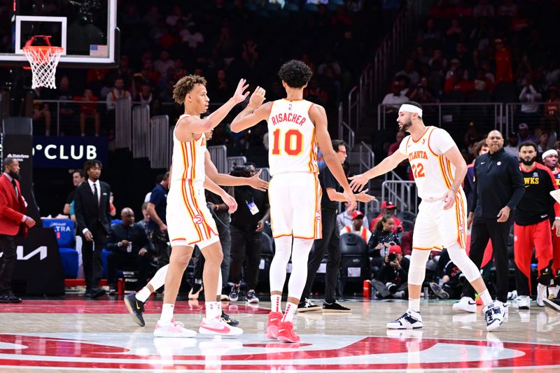 ATLANTA, GA - OCTOBER 8: The Atlanta Hawks high five during the game against the Indiana Pacers during a NBA preseason game on October 8, 2024 at State Farm Arena in Atlanta, Georgia.  NOTE TO USER: User expressly acknowledges and agrees that, by downloading and/or using this Photograph, user is consenting to the terms and conditions of the Getty Images License Agreement. Mandatory Copyright Notice: Copyright 2024 NBAE (Photo by Adam Hagy/NBAE via Getty Images)