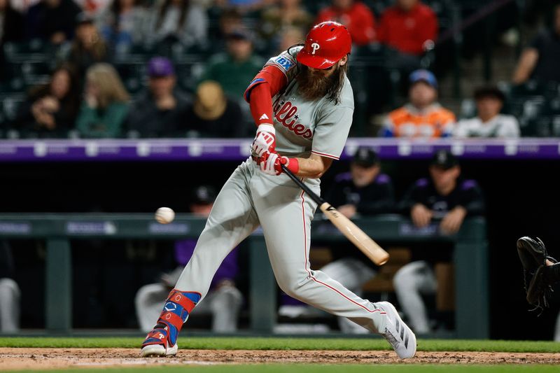 May 20, 2025; Denver, Colorado, USA; Philadelphia Phillies center fielder Brandon Marsh (16) hits a single in the ninth inning against the Colorado Rockies at Coors Field. Mandatory Credit: Isaiah J. Downing-Imagn Images