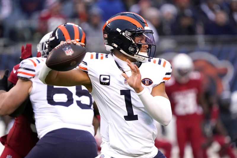 Chicago Bears quarterback Justin Fields passes during the first half of an NFL football game against the Arizona Cardinals, Sunday, Dec. 24, 2023, in Chicago. (AP Photo/David Banks)