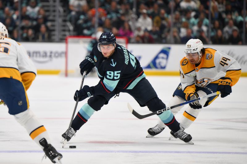 Mar 16, 2024; Seattle, Washington, USA; Seattle Kraken left wing Andre Burakovsky (95) advances the puck while defended by Nashville Predators left wing Kiefer Sherwood (44) during the second period at Climate Pledge Arena. Mandatory Credit: Steven Bisig-USA TODAY Sports