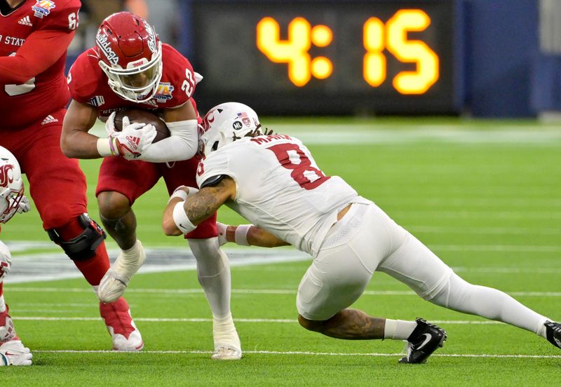 Dec 17, 2022; Inglewood, CA, USA; Fresno State Bulldogs running back Malik Sherrod (22) is stopped by Washington State Cougars defensive back Armani Marsh (8) after a short gain in the second half of the LA Bowl at SoFi Stadium. Mandatory Credit: Jayne Kamin-Oncea-USA TODAY Sports