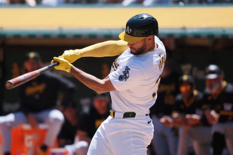 May 1, 2024; Oakland, California, USA; Oakland Athletics second baseman Abraham Toro (31) hits a solo home run against the Pittsburg Pirates during the second inning at Oakland-Alameda County Coliseum. Mandatory Credit: Kelley L Cox-USA TODAY Sports