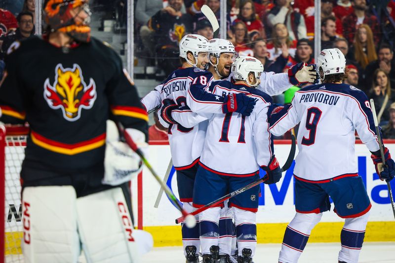 Jan 25, 2024; Calgary, Alberta, CAN; Columbus Blue Jackets defenseman Damon Severson (78) celebrates his goal with teammates against Calgary Flames goaltender Jacob Markstrom (25) during the first period at Scotiabank Saddledome. Mandatory Credit: Sergei Belski-USA TODAY Sports