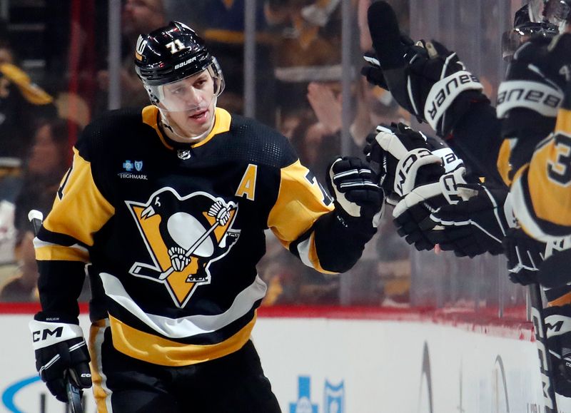 Apr 6, 2024; Pittsburgh, Pennsylvania, USA;  Pittsburgh Penguins center Evgeni Malkin (71) celebrates with the Pens bench after scoring a goal against the Tampa Bay Lightning during the second period at PPG Paints Arena. Mandatory Credit: Charles LeClaire-USA TODAY Sp