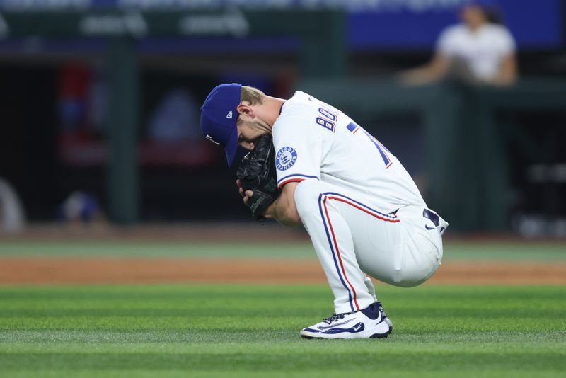 May 14, 2025; Arlington, Texas, USA; Texas Rangers pitcher Caleb Boushley (70) gets ready to pitch during the seventh inning against the Colorado Rockies at Globe Life Field. Mandatory Credit: Tim Heitman-Imagn Images