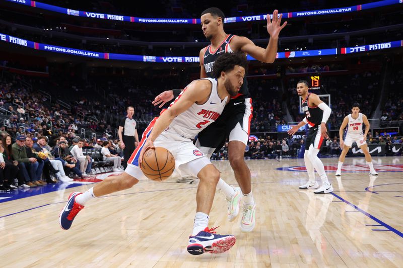 DETROIT, MICHIGAN - JANUARY 06: Cade Cunningham #2 of the Detroit Pistons drives around Kris Murray #24 of the Portland Trail Blazers during the first half at Little Caesars Arena on January 06, 2025 in Detroit, Michigan. NOTE TO USER: User expressly acknowledges and agrees that, by downloading and or using this photograph, User is consenting to the terms and conditions of the Getty Images License. (Photo by Gregory Shamus/Getty Images)