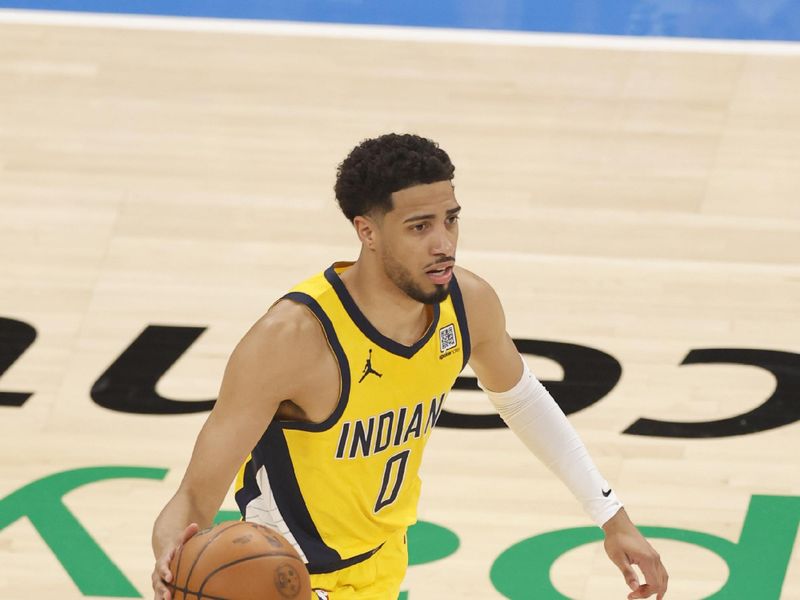 OKLAHOMA CITY, OK - JUNE 8: Tyrese Haliburton #0 of the Indiana Pacers dribbles the ball during the game against the Oklahoma City Thunder during Game Two of the 2025 NBA Finals on June 8, 2025 at Paycom Center in Oklahoma City, Oklahoma. NOTE TO USER: User expressly acknowledges and agrees that, by downloading and or using this photograph, User is consenting to the terms and conditions of the Getty Images License Agreement. Mandatory Copyright Notice: Copyright 2025 NBAE (Photo by Logan Riely /NBAE via Getty Images)