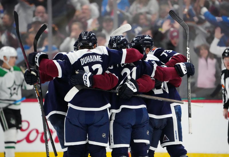 Apr 7, 2024; Denver, Colorado, USA; Colorado Avalanche center Ross Colton (20) and right wing Brandon Duhaime (12) and center Yakov Trenin (73) celebrate a goal in the first period against the Dallas Stars at Ball Arena. Mandatory Credit: Ron Chenoy-USA TODAY Sports