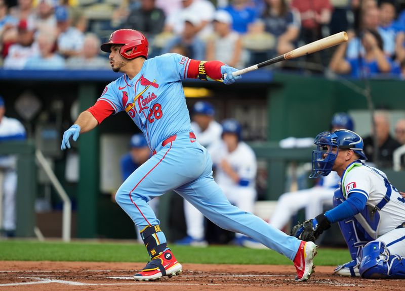 Aug 10, 2024; Kansas City, Missouri, USA; St. Louis Cardinals third baseman Nolan Arenado (28 hits a single against the Kansas City Royals during the first inning at Kauffman Stadium. Mandatory Credit: Jay Biggerstaff-USA TODAY Sports