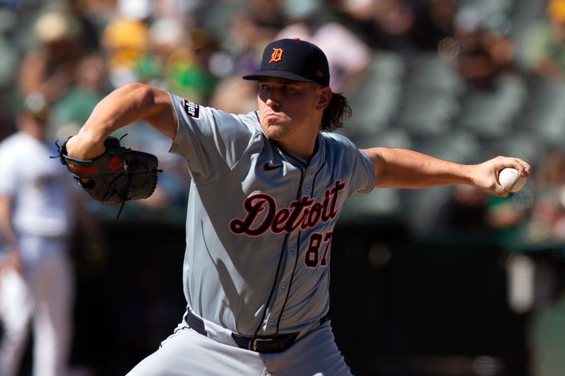 Sep 8, 2024; Oakland, California, USA; Detroit Tigers pitcher Tyler Holton (87) delivers a pitch against the Oakland Athletics during the seventh inning at Oakland-Alameda County Coliseum. Mandatory Credit: D. Ross Cameron-Imagn Images