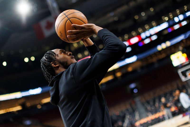 TORONTO, CANADA - FEBRUARY 22: Immanuel Quickley #5 of the Toronto Raptors warms up ahead of their NBA game against the Brooklyn Nets at Scotiabank Arena on February 22, 2024 in Toronto, Canada. NOTE TO USER: User expressly acknowledges and agrees that, by downloading and or using this photograph, User is consenting to the terms and conditions of the Getty Images License Agreement. (Photo by Cole Burston/Getty Images)