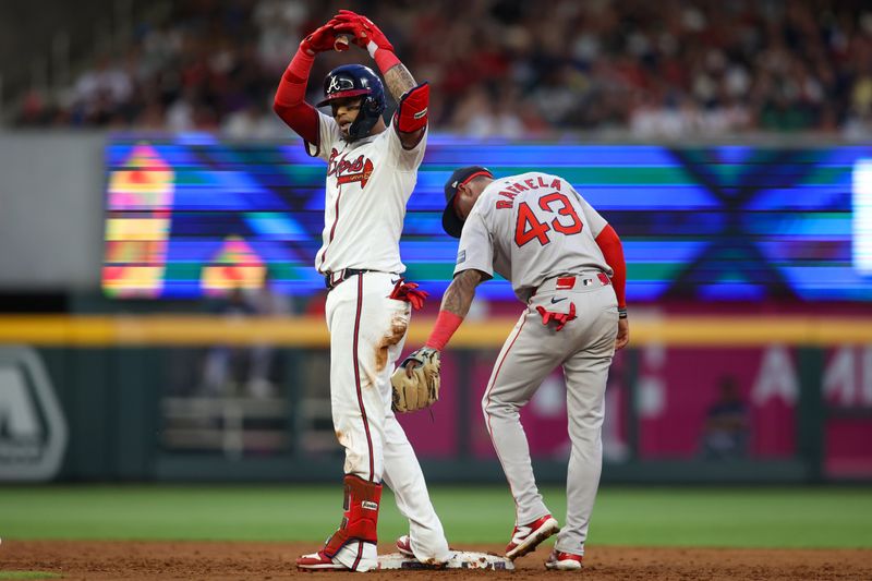 May 8, 2024; Atlanta, Georgia, USA; Atlanta Braves shortstop Orlando Arcia (11) reacts after a double against the Boston Red Sox in the third inning at Truist Park. Mandatory Credit: Brett Davis-USA TODAY Sports
