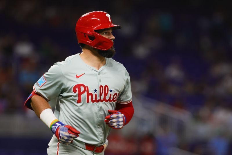 Sep 6, 2024; Miami, Florida, USA; Philadelphia Phillies designated hitter Kyle Schwarber (12) circles the bases after hitting a two-run home run against the Miami Marlins during the sixth inning at loanDepot Park. Mandatory Credit: Sam Navarro-Imagn Images