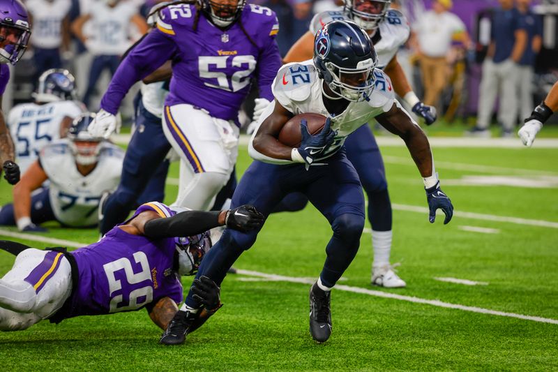 Tennessee Titans running back Tyjae Spears (32) rushes against the Minnesota Vikings in the first half of a preseason NFL football game, Saturday, Aug. 19, 2023, in Minneapolis. (AP Photo/Bruce Kluckhohn)